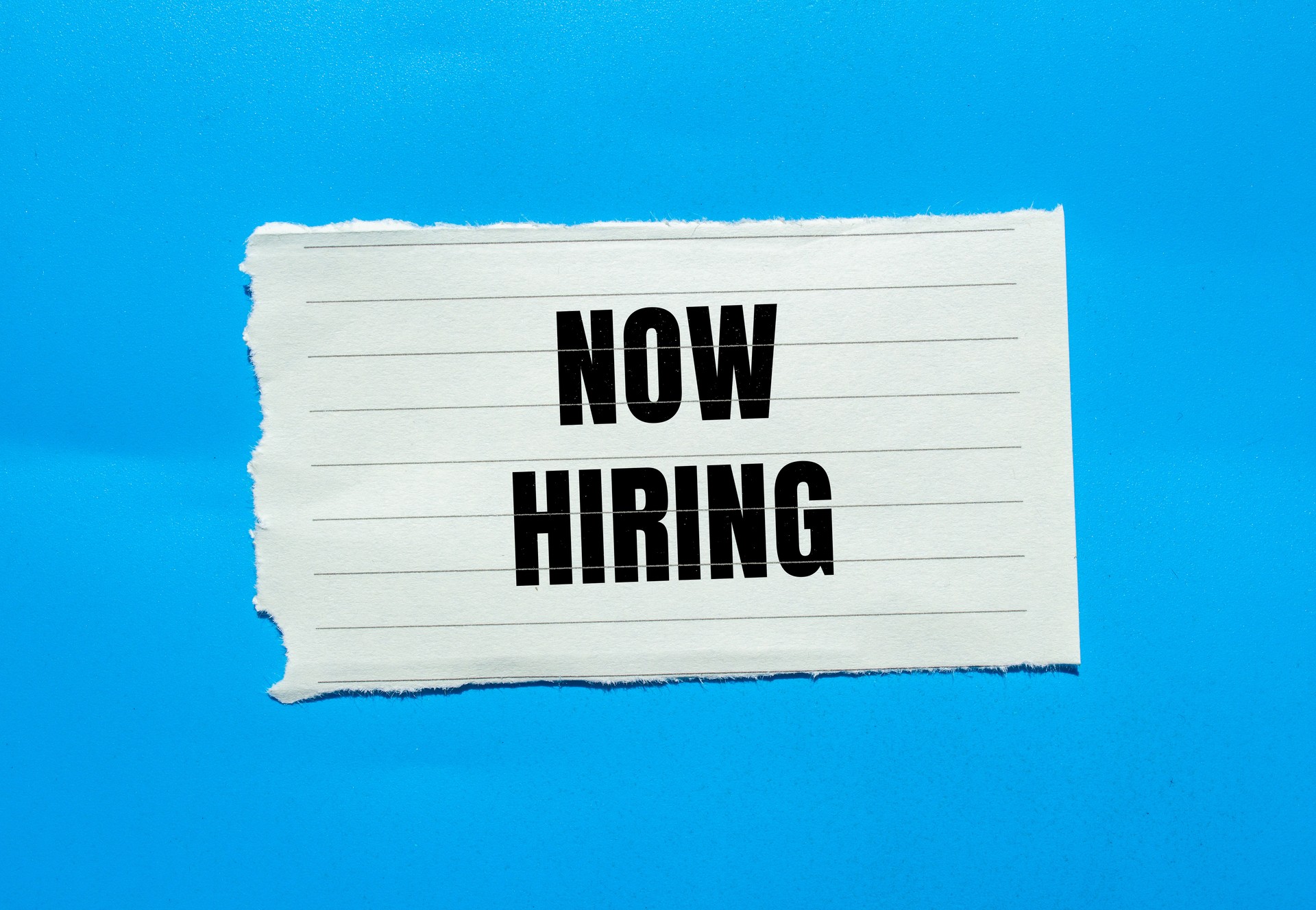 Now hiring lettering on ripped paper